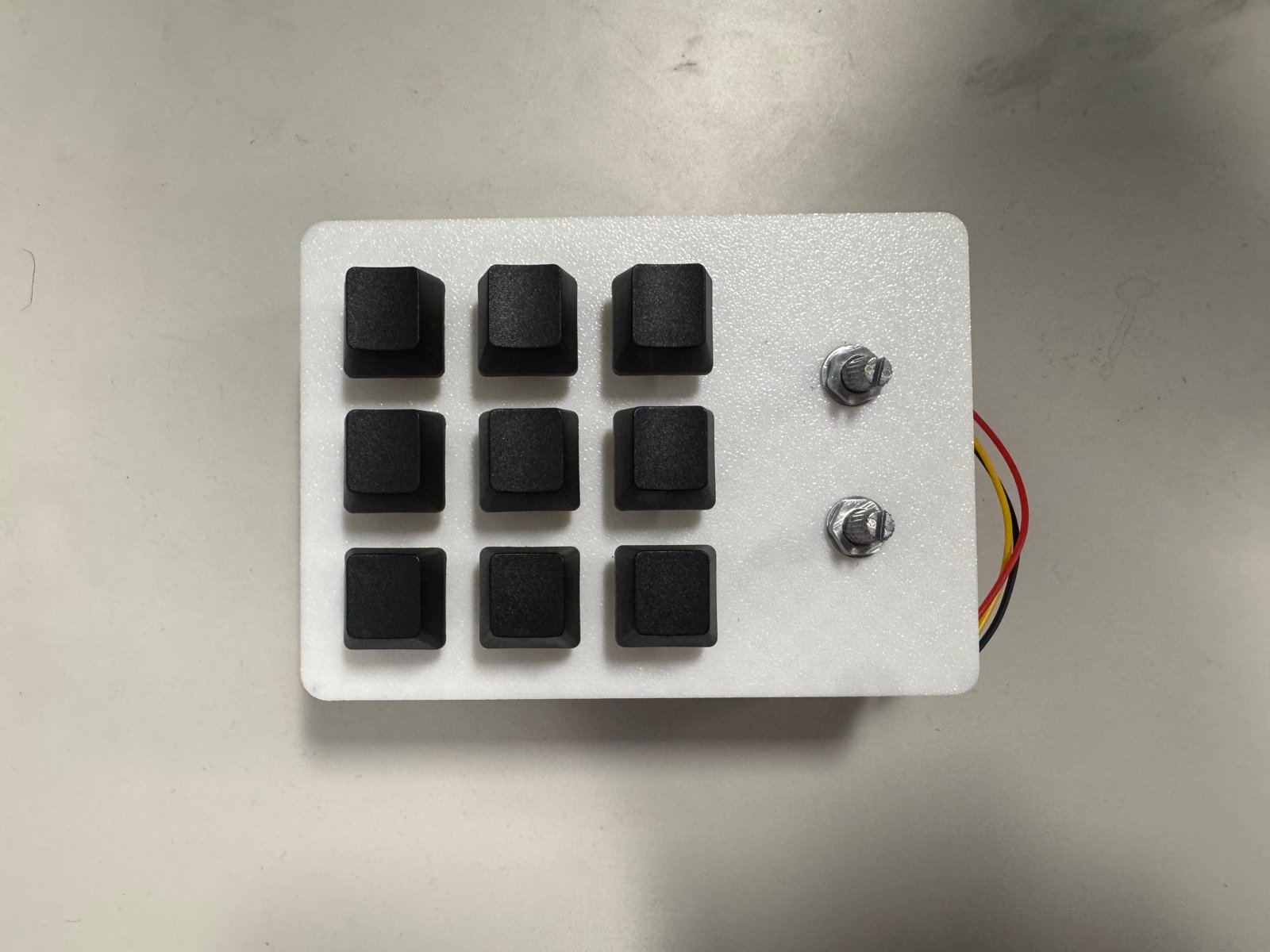 Finished 3x3 MIDI grid controller with nine buttons and two knobs