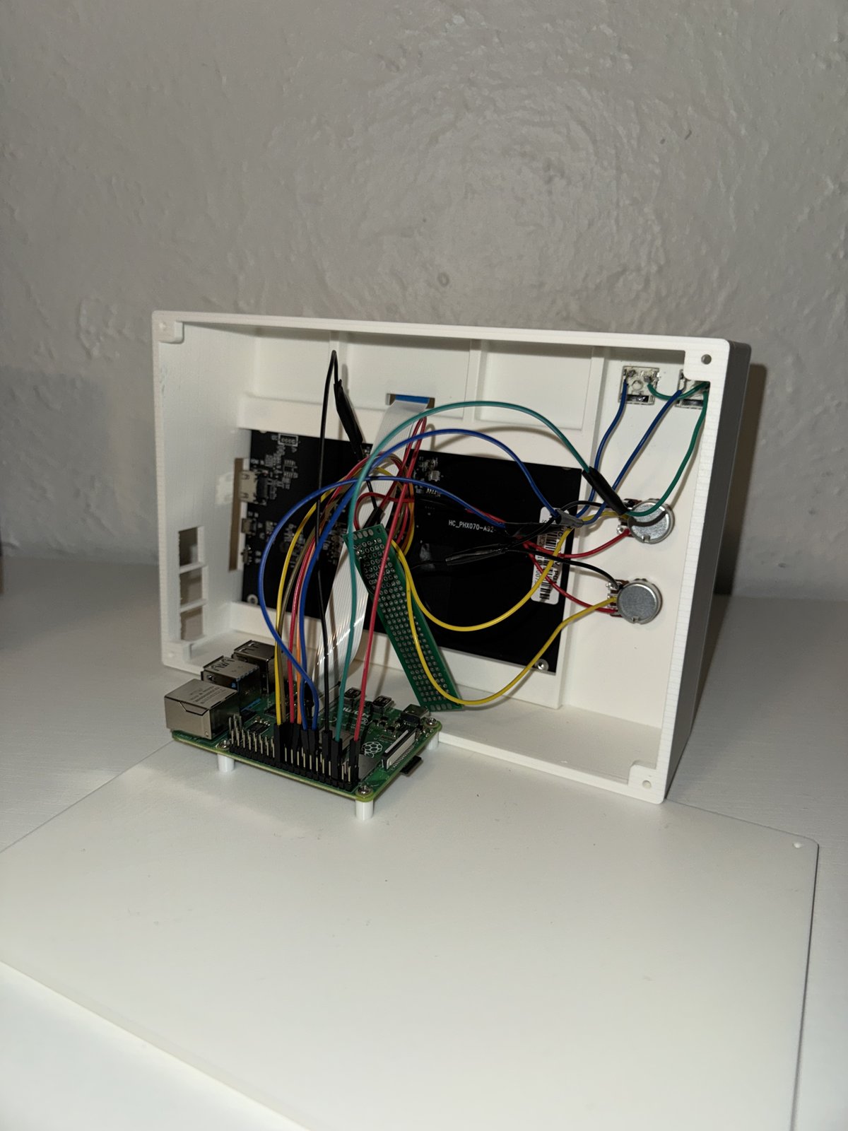 Air Piano enclosure interior showing Raspberry Pi, display, potentiometers, and wiring